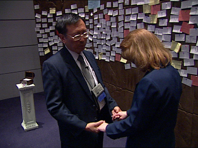 Noel Goh and the 250 other prayer delegates volunteer their time to pray with people they’ve never met, and may never see again. Video still by UMTV/United Methodist Communications