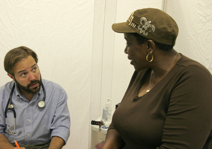 Sharon Young talks with Dr. Brent Wallas at Luke's House, a free medical clinic held every Tuesday evening in Mount Zion United Methodist Church. UMNS photos by Kathy L. Gilbert.