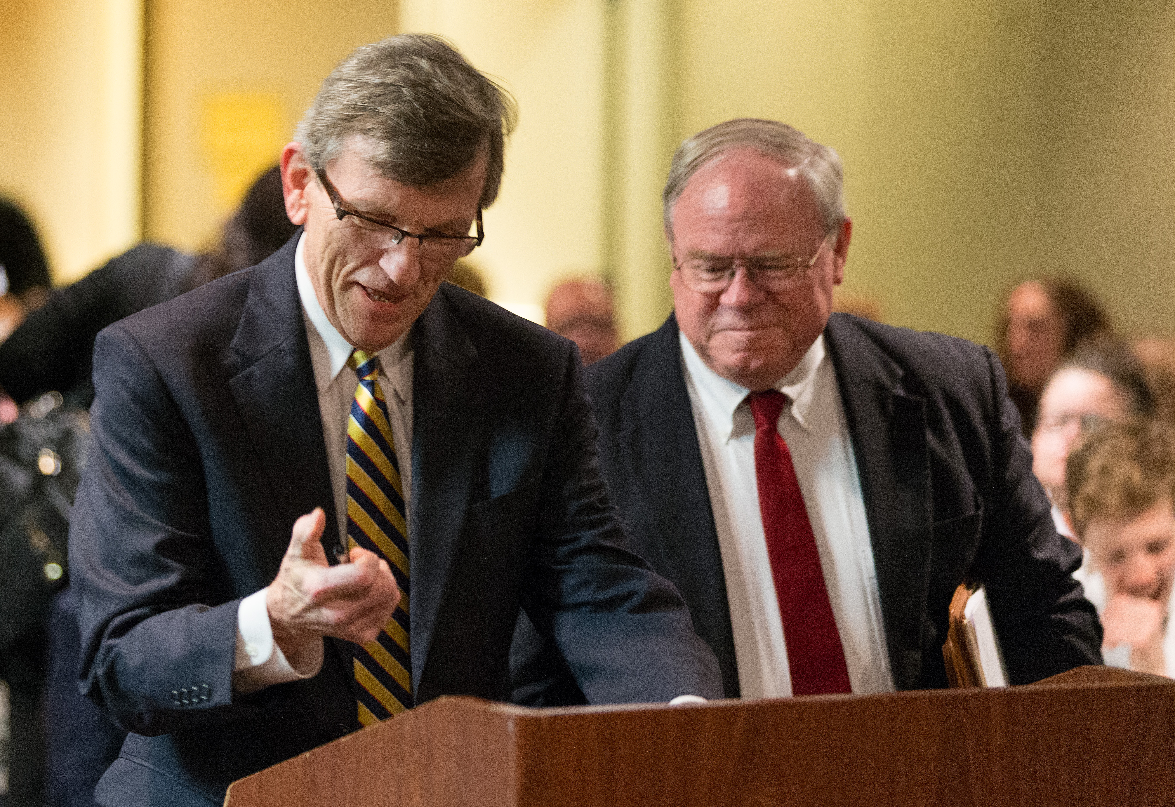 Richard Marsh (left) and the Rev. Keith Boyette (right), representatives for opposing sides, prepare to present their arguments before the United Methodist Judicial Council. Photo by Mike DuBose, UMNS