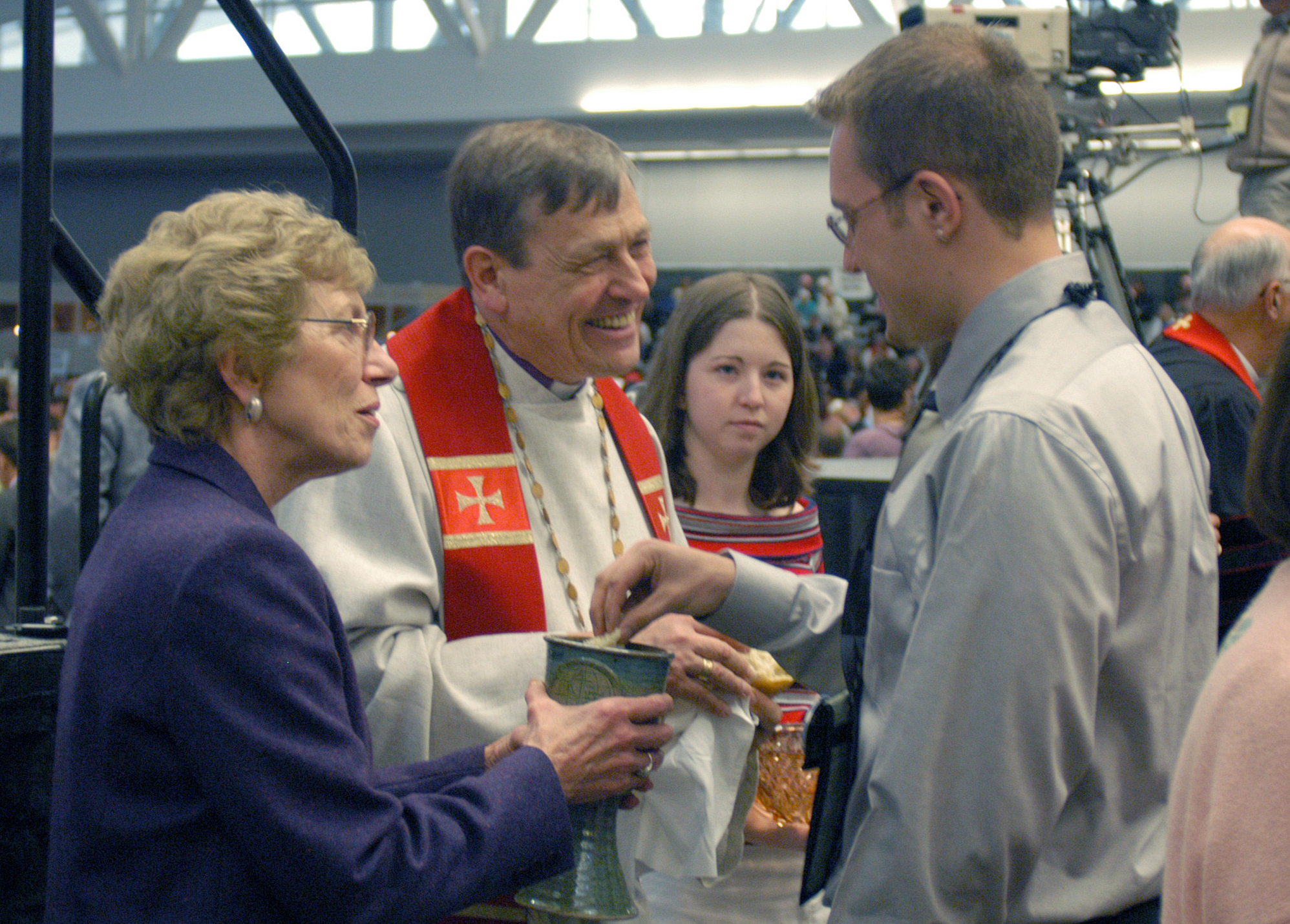 United Methodist Bishop Ruediger R. Minor (center) serves communion during the opening worship of the United Methodist Church's 2004 General Conference in Pittsburgh. Photo by John C. Goodwin, UMNS.