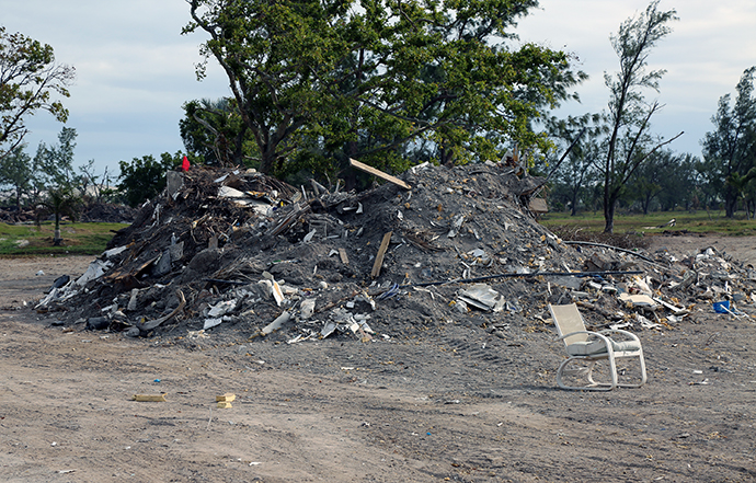 Debris from Hurricane Irma sits in massive piles on an abandoned golf course in Marathon, Fla.  Photo by Deborah Coble, Florida Conference. 