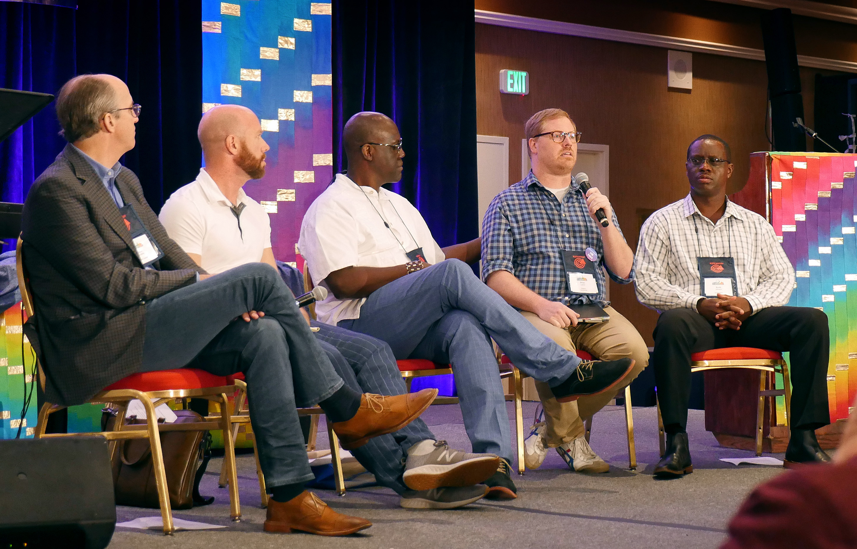 The Rev. Brian Atkins (second from right) speaks about the plans on offer from the Commission on Way Forward during the For Everyone Born gathering in St. Louis. Fellow commission members (from left) Dave Nuckols, Matt Berryman and Scott Johnson (furthest right) spoke about their work. Randall Miller (center) moderated the conversation. Photo by Heather Hahn, UMNS