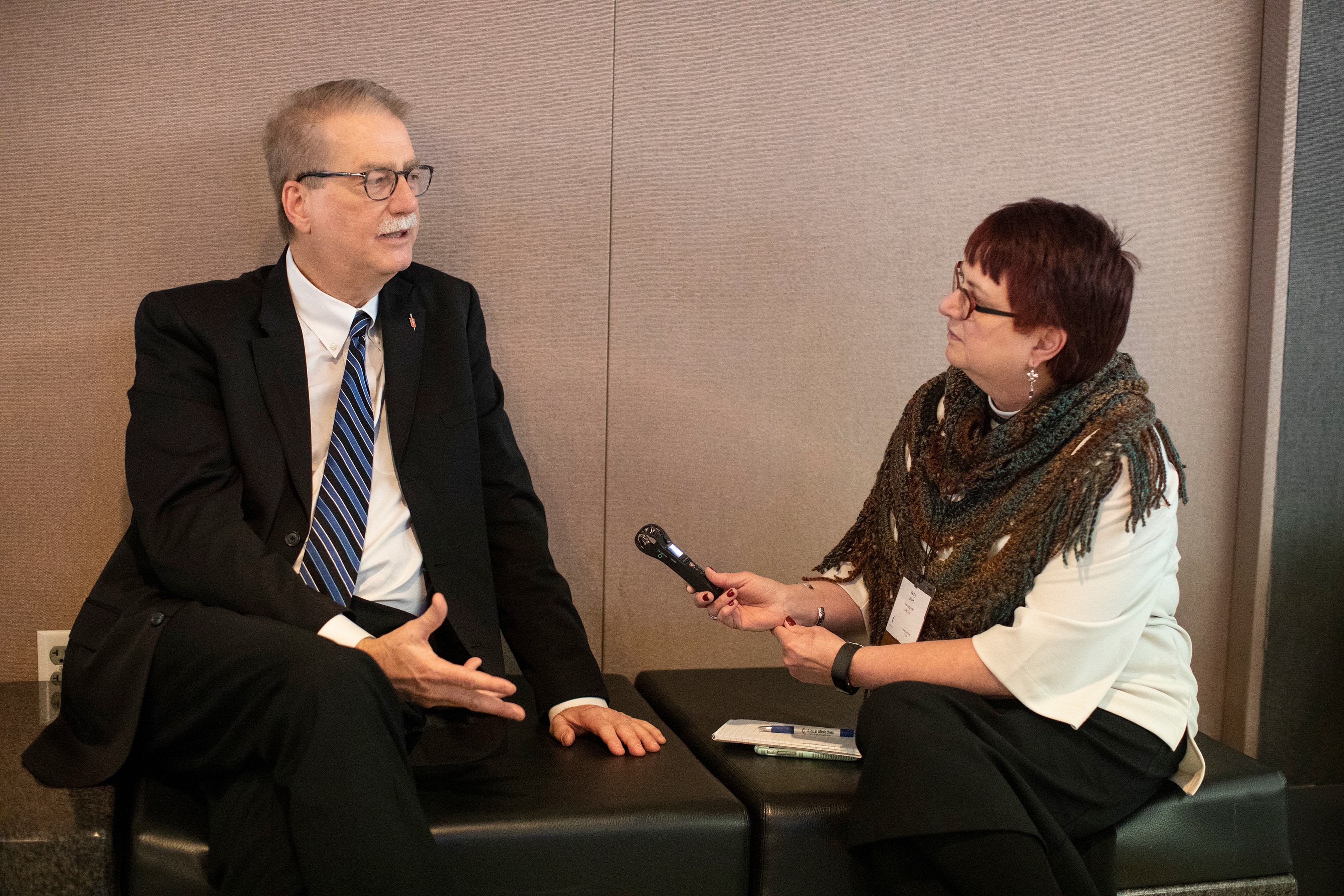 Bishop Kenneth H. Carter answers questions asked by United Methodist news reporter, Kathy L. Gilbert, during the 2019 United Methodist General Conference in St. Louis. Photo by Kathleen Barry, UMNS.