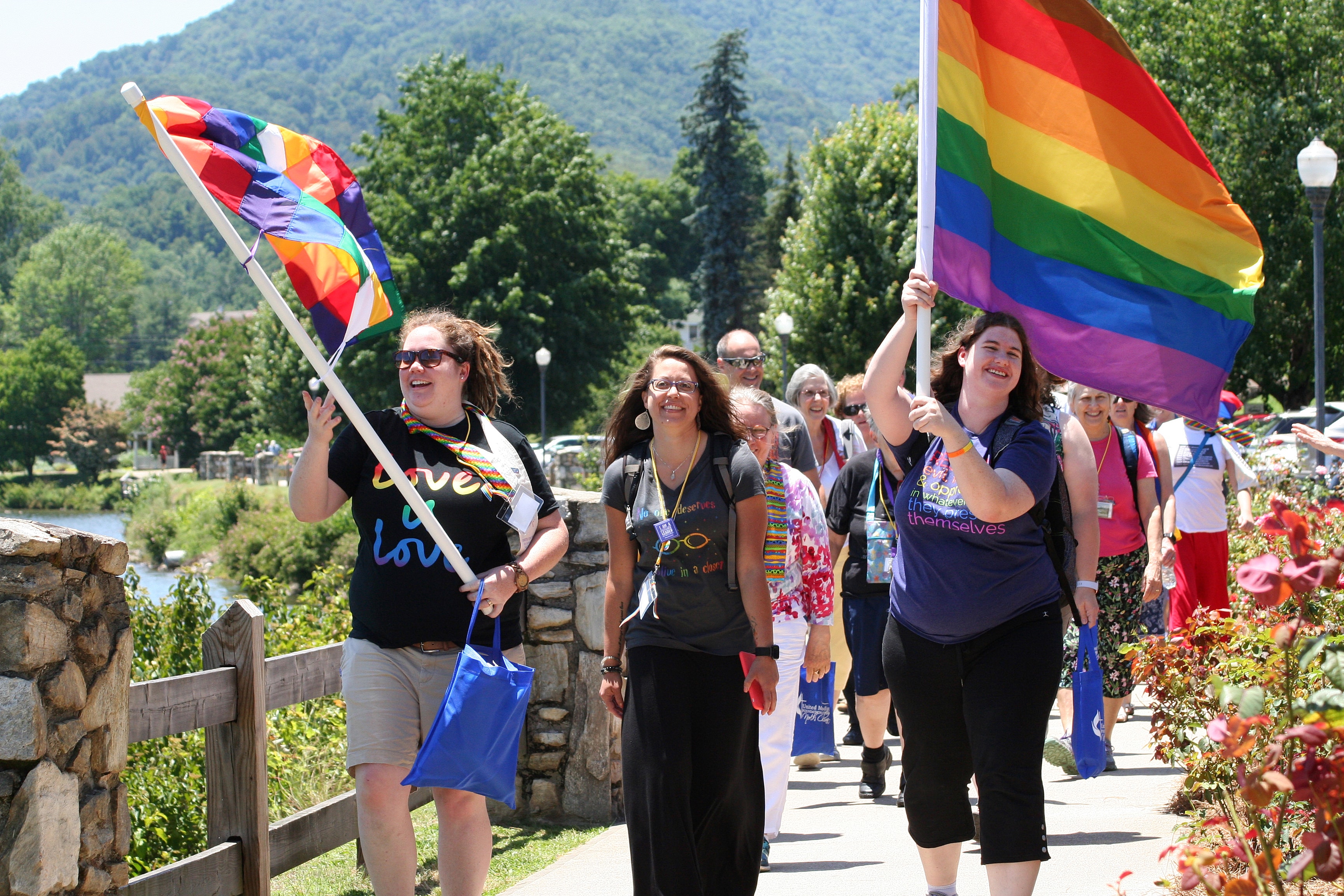 Participants walk in a Reconciling Ministries Pride March during the 2019 Western North Carolina Annual Conference held at Lake Junaluska. Photo by Neill Caldwell, Western North Carolina Conference.