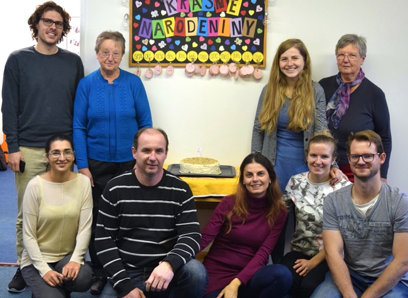 The Rev. Patrik Hipp and his wife, Zuzana Hipp (kneeling, second and third from left), pose with a small group of worshippers of the United Methodist mission congregation in Dolný Kubín, Slovakia. Photo courtesy of Rev. Patrik Hipp.
