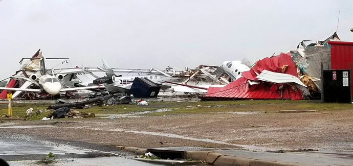 View of the destroyed hangar and multiple damaged private planes at Monroe Regional Airport, Monroe, La., after devastating storms swept across the southern United States April 12. The image, shared from the City of Monroe’s Twitter account, was accompanied by the notice: “Due to weather conditions and debris removal from the runways …  all flights at the Monroe Regional Airport are cancelled until further notice.” Photo courtesy of City of Monroe.