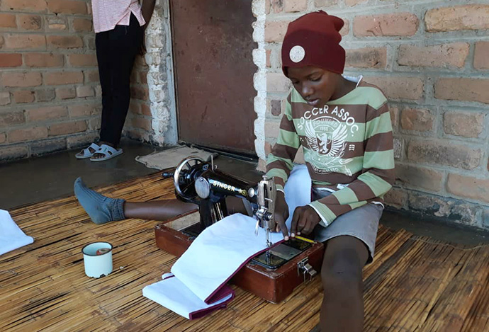 Fortune Muchatuki, a grade seven student at The United Methodist Church’s Hanwa Mission Center primary school in Macheke, Zimbabwe, sews a face mask. A recent $3,000 donation from the Baltimore-Washington Conference’s Zimbabwe Volunteers in Mission team provided material for face masks, food and other necessities. Photo by Kudzai Chingwe, UM News.