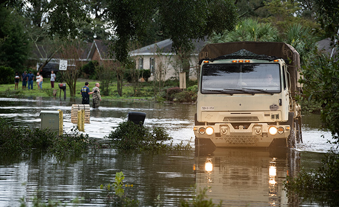Florida National Guard soldiers from Bravo Troop, 1-153 CAV, 53rd IBCT, assist residents of Escambia County, Fla., on Sept. 16 after Hurricane Sally. U.S. Air Force Photo by TSgt. Christopher Milbrodt.