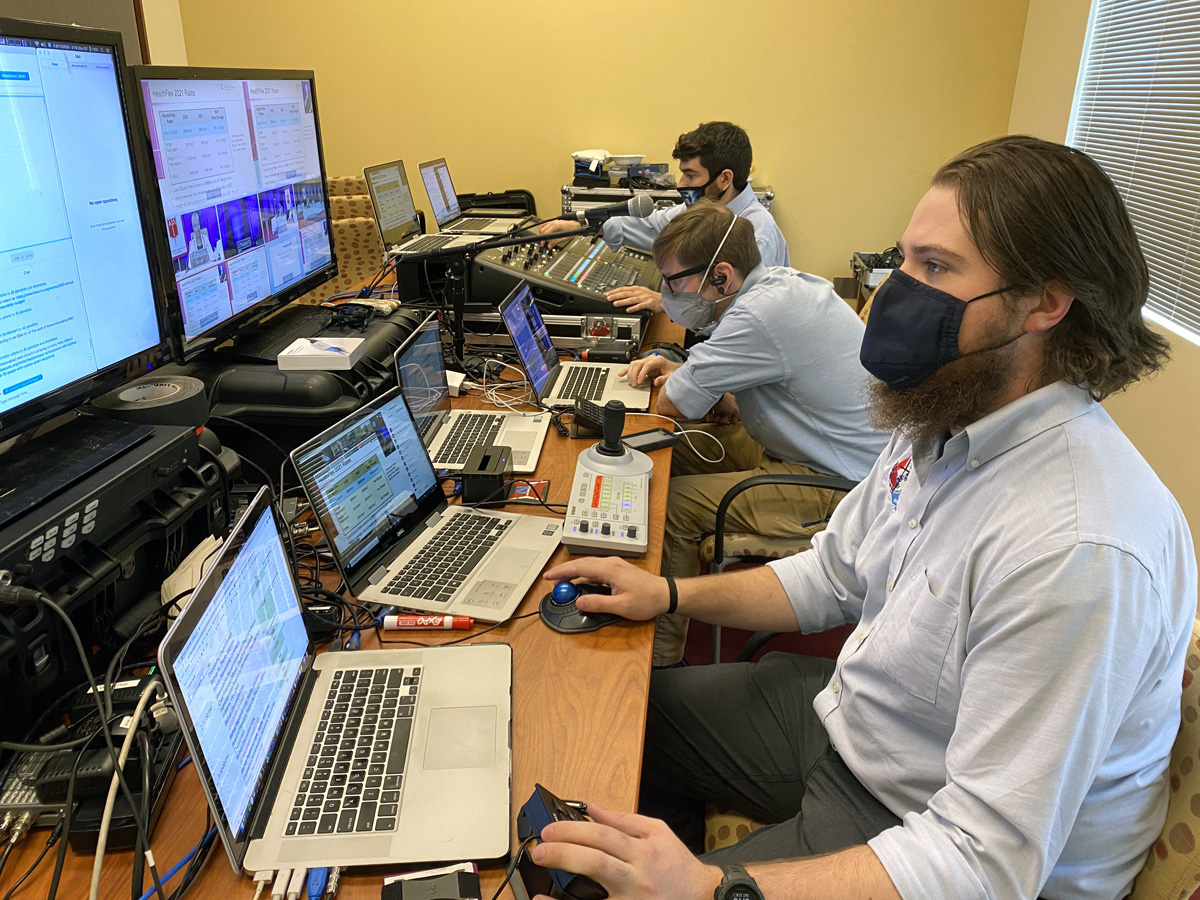 A view of GNTV Media Ministry’s video control room during the Baltimore-Washington Conference annual gathering shows multiple computer screens, audio equipment and busy technicians. Photo courtesy of GNTV Media Ministry.​