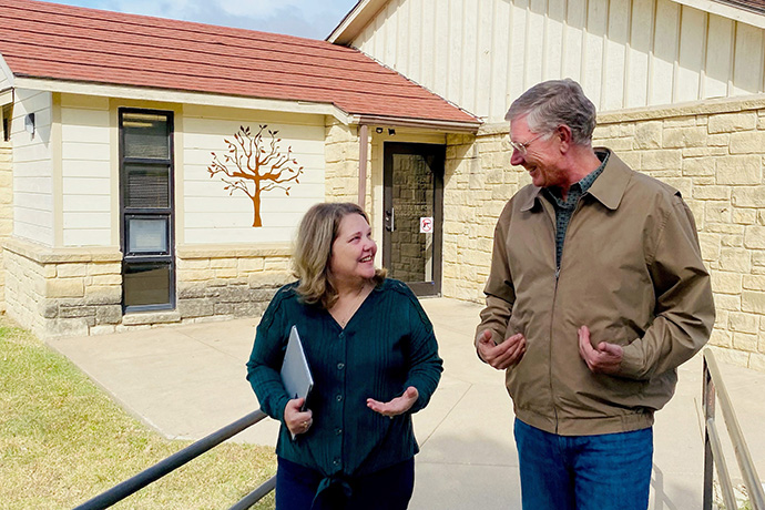 Lisa Buffum and Steve Wilke stroll the campus at The Richard and Julia Wilke Institute for Discipleship at Southwestern College, a United Methodist institution in Winfield, Kansas. They work on BeADisciple, an online learning program for Christians that became more popular during the coronavirus pandemic. Photo by Sara Weinert.