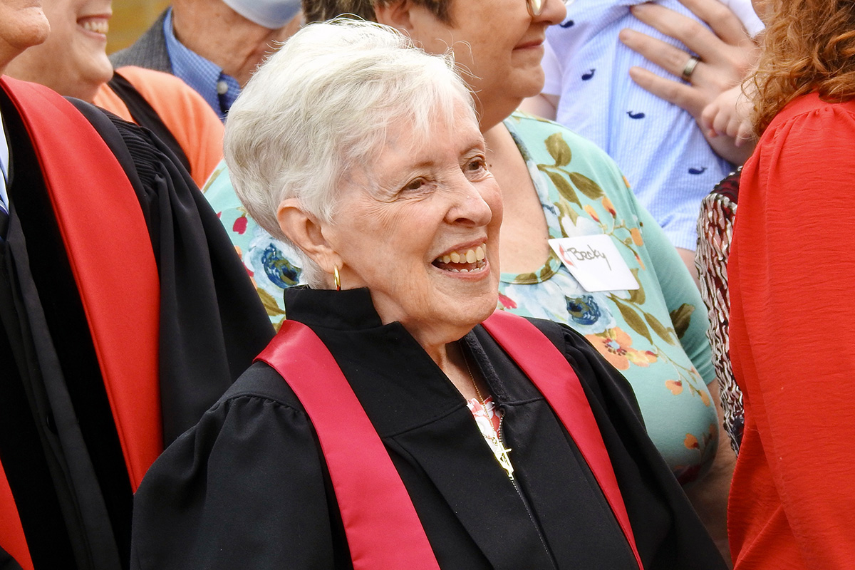 The Rev. Margie McNeir joins in waiting for a group photograph of members of the Amarillo United Methodist after its chartering service on June 4, in Amarillo, Texas. Alarmed at the prospect that Amarillo would, because of disaffiliations, have no United Methodist church, McNeir took the lead in starting Amarillo United Methodist. Photo by Sam Hodges, UM News. 