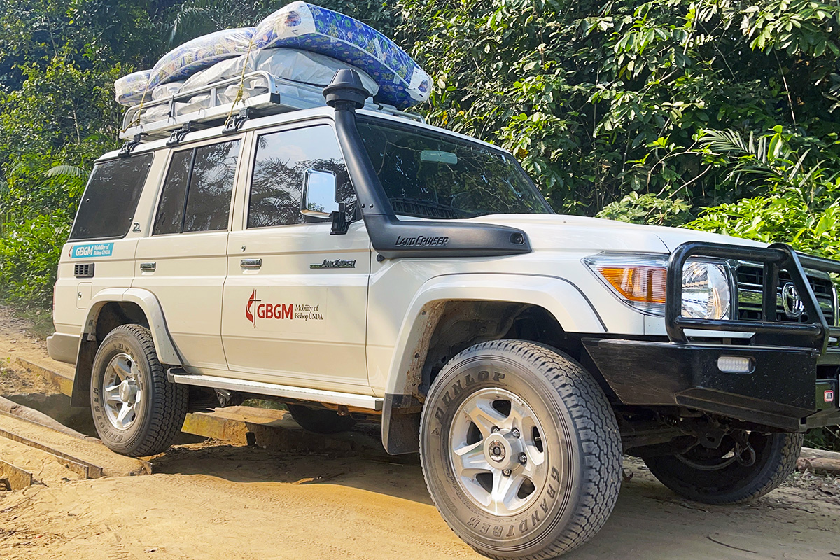 A Land Cruiser crosses a small makeshift bridge on the road to Kibombo in Congo's Maniema Province. The four bishops of the Congo Central Conference recently received the sport utility vehicles to make it easier for them to get around their regions, which have numerous dirt roads that are often impassable during the rainy season. Photo by Chadrack Londe, UM News.