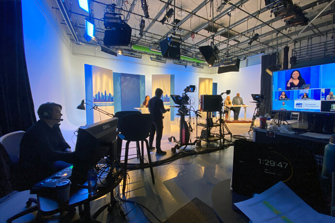 Katie Sluder (far left) operates the teleprompter and floor director Chuck Long stands near the cameras as host Lilla Marigza (seen in monitor) sits for the pre-General Conference delegate briefing produced by United Methodist Communications Feb.29-March 1. Dawn Wiggins Hare and Bishop James E. Swanson stand on the far right. Photo by Stacey Hagewood, United Methodist Communications. 