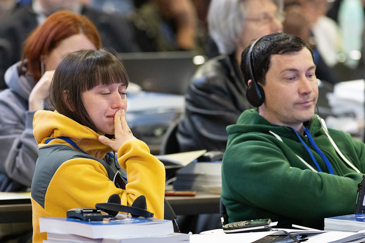 Delegate Julia Stukalova (left) and other members of the Eastern Russia and Central Asia Provisional Conference react as delegates to the United Methodist General Conference, meeting in Charlotte, N.C.,  vote on April 25 to allow their conference to exit the denomination. Photo by Mike DuBose, UM News.