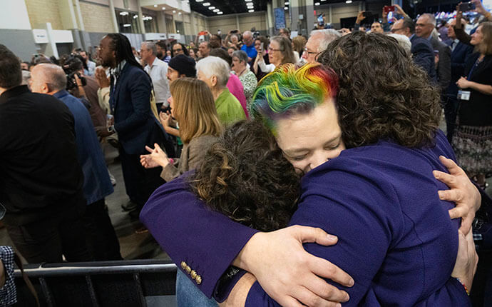 Jesi Lipp, a lay delegate from the Great Plains Conference, gets a hug after General Conference delegates voted to remove The United Methodist Church’s ban on gay clergy during the church’s legislative assembly in Charlotte, N.C., on May 1. Photo by Larry McCormack, UM News.
