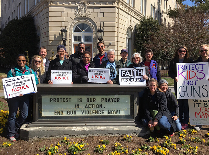 Bishop LaTrelle Easterling, the episcopal leader of the Baltimore-Washington Conference (center), along with other members from Foundry United Methodist Church in Washington, stand in front of the United Methodist Building before a 2018 rally for new gun laws in the U.S. File photo by Sheila George.