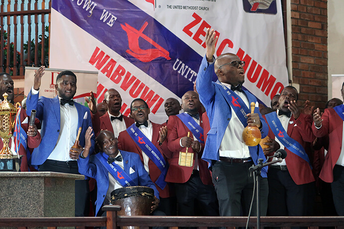 Liberty Maziti, the Zimbabwe East Conference men’s vice-chairperson, sings with his church’s Cranborne Mubvuwi we United Methodist Church choir at a music festival. Cranborne is the reigning men’s organization music champion in the conference. Photo by Eveline Chikwanah, UM News.