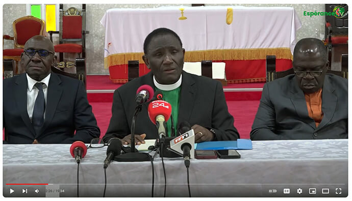 At center, the Rev. Isaac Bodjé, Côte d’Ivoire Conference secretary, reads a statement to local press that explains the Côte d'Ivoire Conference is leaving because of changes made by the recent General Conference. He is accompanied by other conference leaders. Screengrab courtesy of the Côte d'Ivoire Conference via YouTube by UM News.
