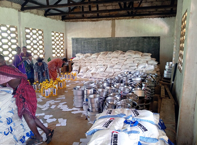 Sacks of rice, cooking pots and vegetable oil are collected in a warehouse prior to distribution to flood victims in the Masai District of Tanzania. Devastating floods ravaged the region in December and January, affecting more than 6,300 people in numerous villages. Photo courtesy of the North Katanga Episcopal Area disaster management office.