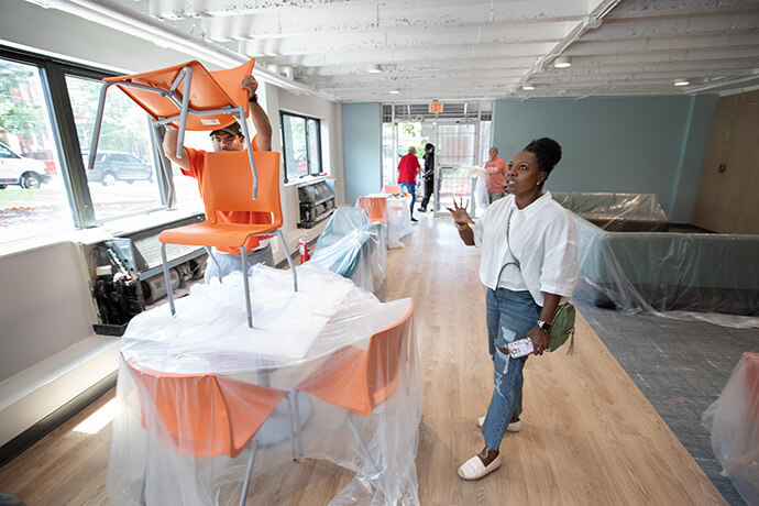 The Rev. Dawn Wright supervises last-minute preparations for the service of dedication for the revamped student center at Gammon Theological Seminary. Wright serves as project manager for the school’s renovations. Photo by Mike DuBose, UM News.