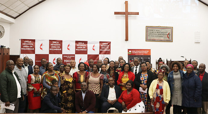 Church members pose for a photo on July 31 at Malanga United Methodist Church in Maputo, Mozambique, following the launch of the Local Advance Project, a new online giving platform. Photo by Roque Facela.