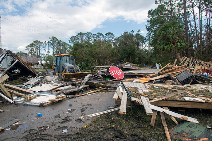 U.S. airmen with the Florida Air National Guard clear roads in Keaton Beach, Florida, on Sept. 27 after Hurricane Helene made landfall. Photo by Staff Sgt. Jacob Hancock, U.S. Air National Guard.