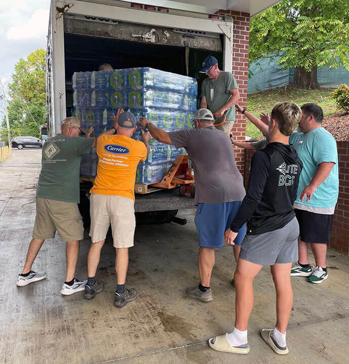 Volunteers at Trinity United Methodist Church unload water for flood survivors in Greeneville, Tennessee. Photo by Ken Bailey, courtesy of the Holston Conference.