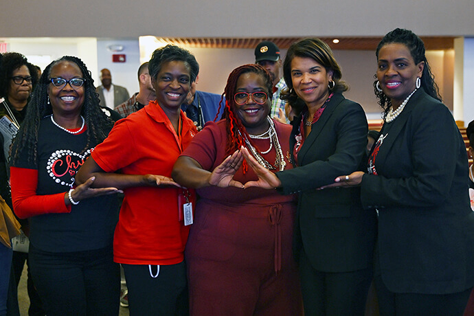 Kemba Smith (second from right), a prison reform activist who served six years in prison before being granted clemency, poses Oct. 3 at St. James Church in Kansas City, Mo., with other members of the Delta Sigma Theta Sorority. From left to right are Gwendolyn Burke, Angela Richardson, Dionne Greenfield, Smith and Sharon Franklin. Photo by Fred Koenig, Missouri Conference.