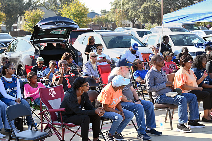 Members of the congregation at The Village United Methodist Church in DeSoto, Texas, worship in the church parking lot on Oct. 27. Photo by Jim Patterson, UM News.