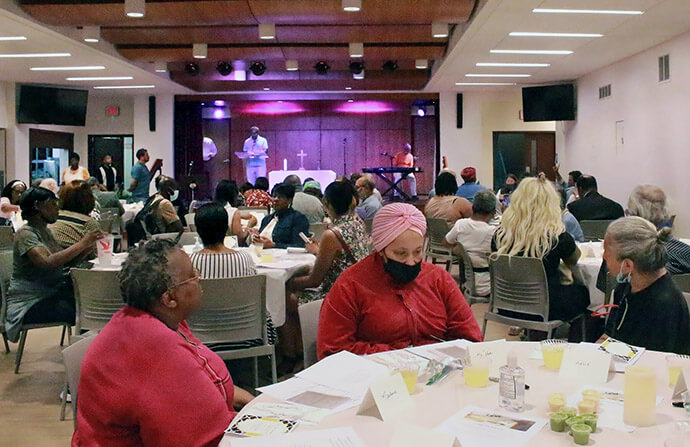 Participants enjoy a musical performance during Dinner Church, a ministry of Asbury United Methodist Church in Washington, D.C. Started in 2023, Dinner Church happens on the first Saturday evening of each month. Photo courtesy of Asbury United Methodist Church. 