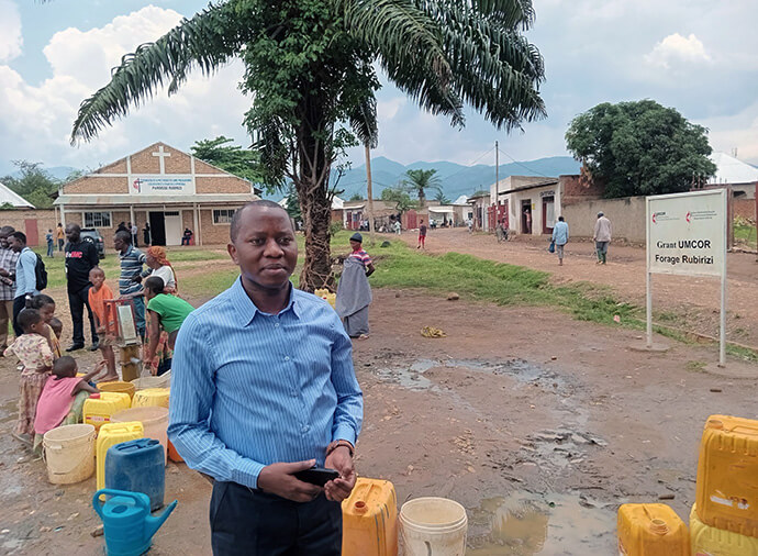 The Rev. Buratangaje Japhet, assistant pastor of the Ruburizi parish, credits the free drilling of boreholes with increasing church attendance. Photo by Jérôme Ndayisenga, UM News.  