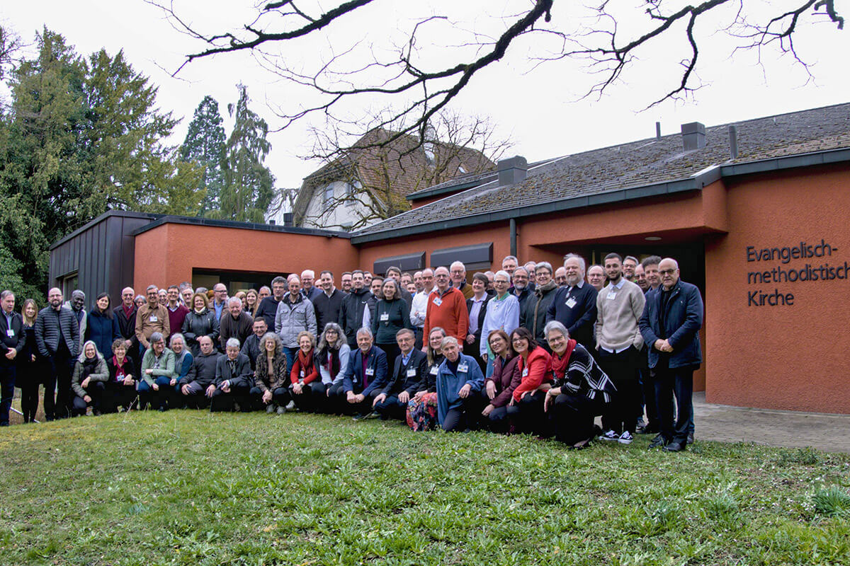 United Methodists at the Central and Southern Europe Central Conference stand together outside Winterthur United Methodist Church in Winterthur, Switzerland, where they met. Photo by the Rev. Jörg Niederer, Central and Southern Europe Central Conference.
