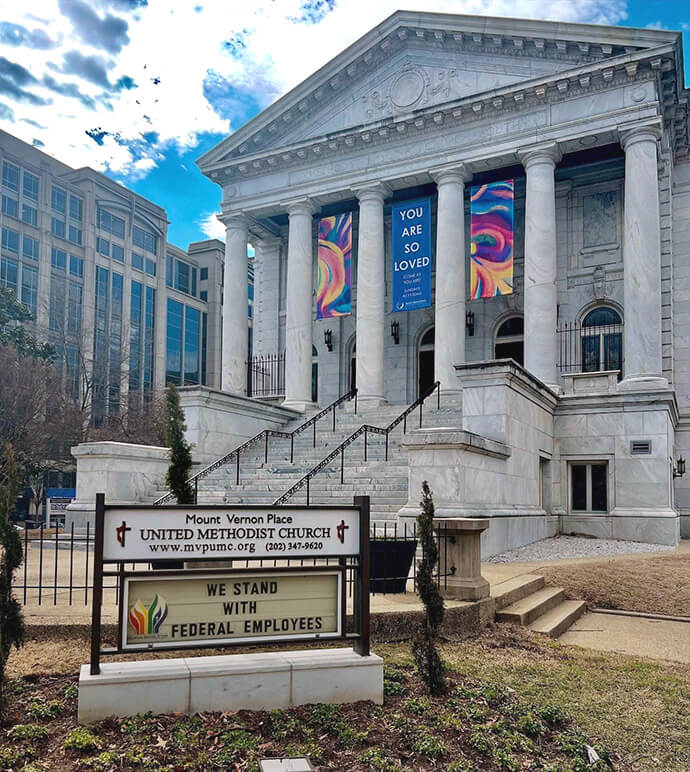 Mount Vernon Place United Methodist Church in downtown D.C. has many people in its congregation who have worked with the federal government or for organizations funded by federal grants. The church has changed its marquee sign to reflect its support for the people who provide government services. Photo courtesy of the Rev. Donna Claycomb Sokol, Mount Vernon Place United Methodist Church.