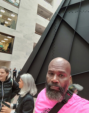 Jerome Hinkle, at right, stands outside a congressional office building where he joined fellow members of Capitol Hill United Methodist Church in advocating for the D.C. budget in jeopardy because it was not included in the continuing resolution to fund the federal government signed into law March 15. Photo by Jerome Hinkle, Capitol Hill United Methodist Church. 
