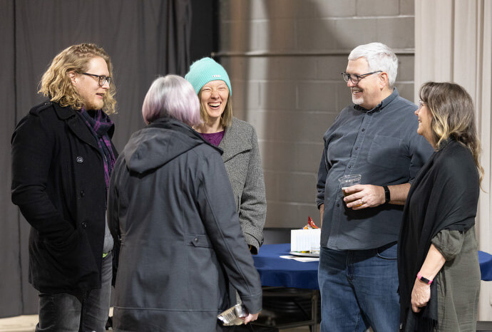 The Rev. Dale Cohen and his wife, Ann (right), welcome guests to the Crafted Conversations discussion group. The program is a ministry of First United Methodist Church in Florence, Ala., where Cohen serves as senior pastor.