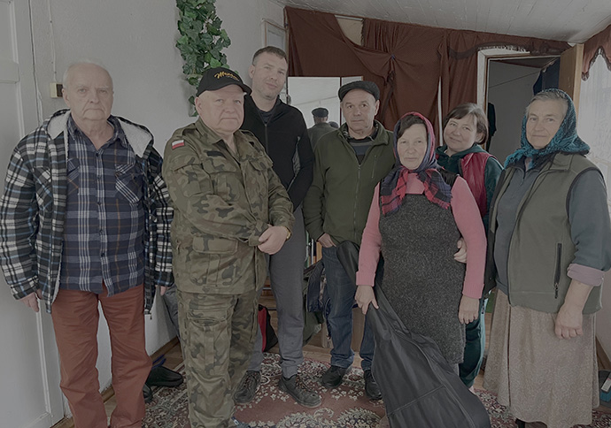 Jarosław Bator (second from left), pastor of Puławy United Methodist Church in Poland, visits with Ukrainian citizens during a trip to the war-torn nation. Bator visits Ukraine monthly, preaching regularly at two locations. Photo courtesy of Jarosław Bator.