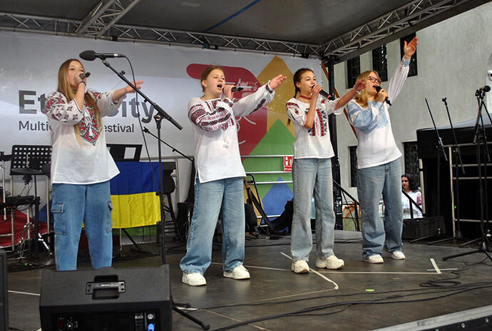 Youth from Ukraine sing during a Romanian festival in Cluj-Napoca. Families from Ukraine are starting to build new lives in the country and other neighboring nations after fleeing their homes because of the war with Russia. Photo courtesy of Sarah Putman.