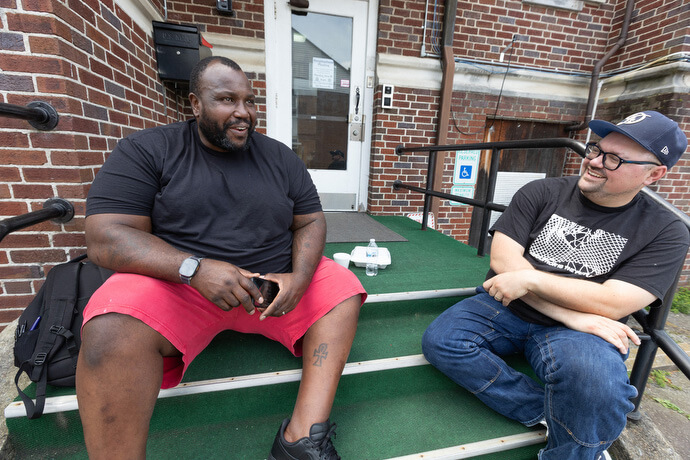 The Rev. Dustin Mailman (right) visits with Gene Ettison who serves on the advisory committee at Deep Time. Photo by Mike DuBose, UM News.