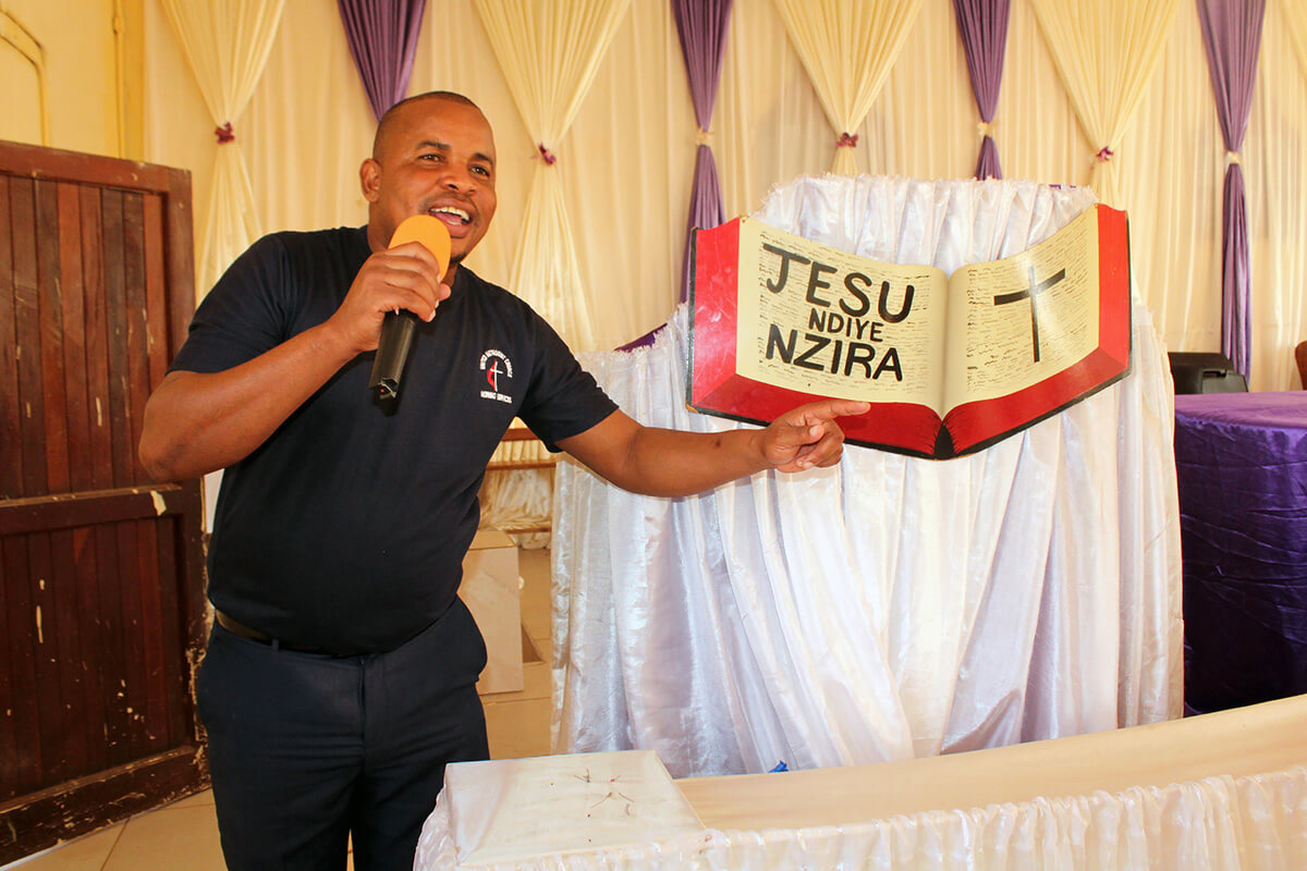 Tawanda Nkomo preaches during Morning Service in Nyanyadzi, a farming community in rural Zimbabwe. Nkomo, who struggled with alcoholism, says his involvement in the United Methodist ministry has changed his life. Photo by Kudzai Chingwe, UM News. 