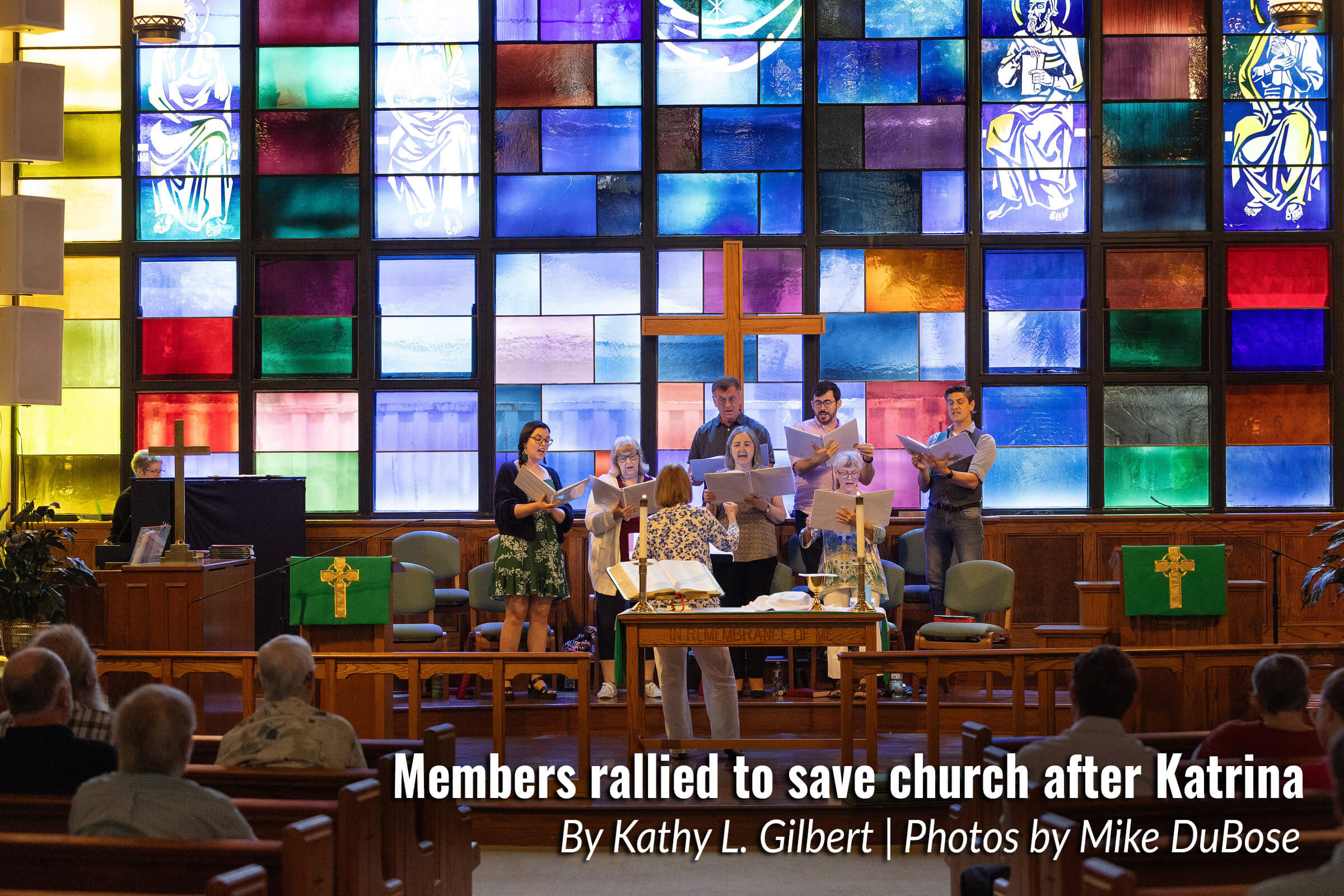 Sunlight streams through the stained-glass windows as the choir sings during worship at St. Luke’s United Methodist Church in New Orleans in July 2025.