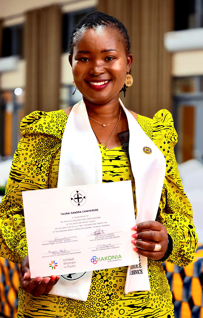 Deaconess Taurai Sandra Chinyerere of the Zimbabwe West Conference holds her certificate of consecration during the Africa Region Deaconess/Home Missioner service on July 9 in Moshi, Tanzania. Photo courtesy of Laurel Akin.