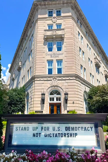 The sign in front of the United Methodist Building currently proclaims, “Stand Up for U.S. Democracy, Not Dictatorship.” The building, across from the U.S. Supreme Court, is overseen by the United Methodist Board of Church and Society and also houses the United Methodist Commission on Religion and Race, among other nonprofits. Photo by Jeffrey Corey, Church and Society. 